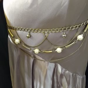 A vintage gold chain belt with faux pearls the belt length is 40 in